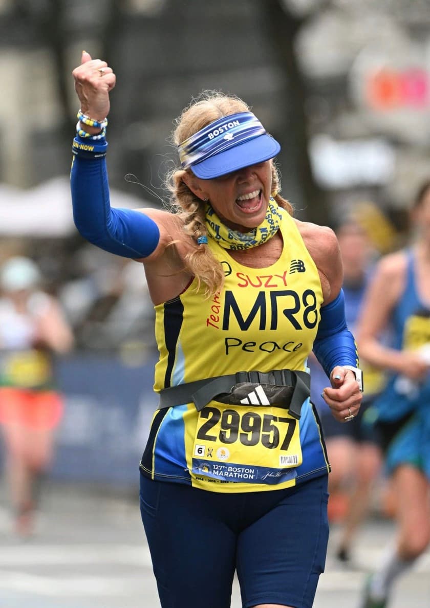A Team MR8 runner celebrating mid-race
